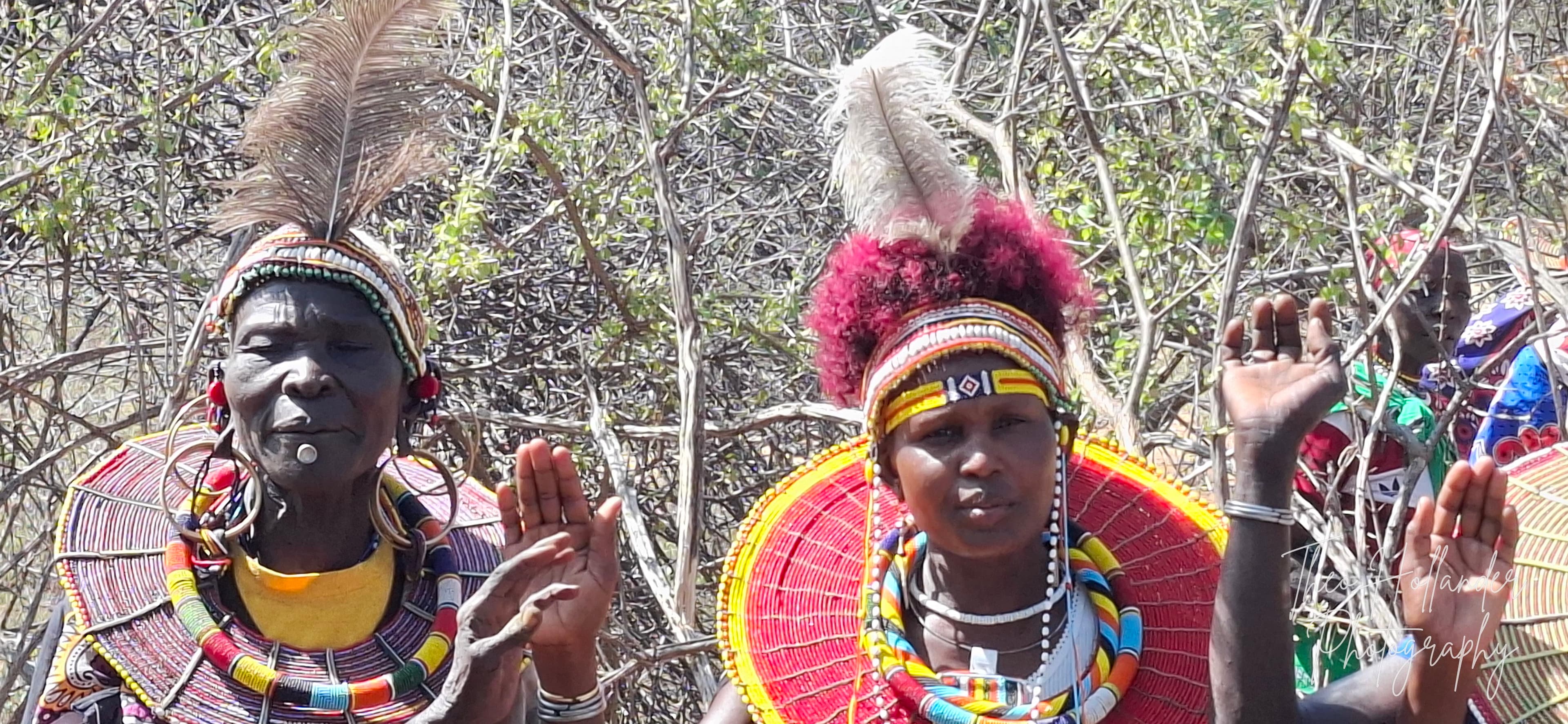 Two women in elaborate traditional beaded headdresses